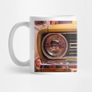 Stylish headlight of yellow vintage sports car Mug